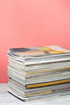 Open stacking book, magazine hardback colorful books on wooden table and re.. Stock Photos
