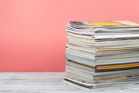 Open stacking book, magazine hardback colorful books on wooden table and re.. Stock Photos