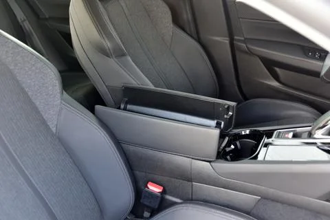 Open storage box between front car seats Stock Photos