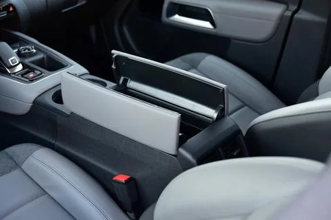 Open storage box between front car seats Stock Photos
