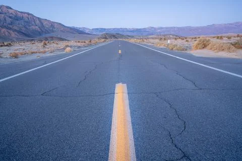 Open stretch of desert highway Stock Photos