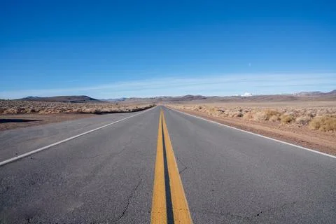 Open stretch of desert highway Stock Photos