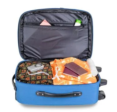 Open Suitcase Open blue suitcase ready for an holiday trip, with digital p... Stock-Fotos