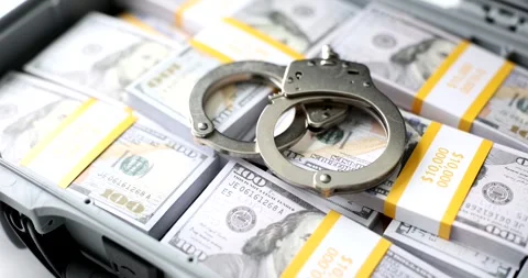 Open suitcase with stack of million dollars and handcuffs Stock Footage 261532480