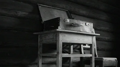 Open suitcase on the table, black and white Stock Footage 110844571