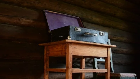 Open suitcase on the table Stock Footage 110844364