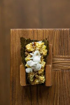 Open sushi roll with white fish and sauce Stock Photos