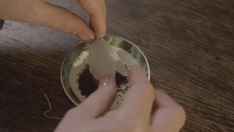 Open a tea bag Stock Footage 176463315