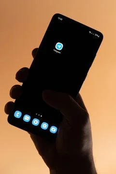 Open  telegram app on smartphone Stock Photos