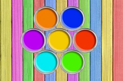 Open tin cans with paint on painted color wooden texture close-up Stock Photos