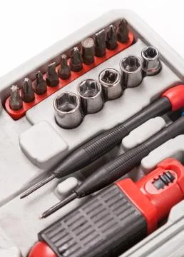 Open toolbox with screwdriver, heads and bit Stock Photos