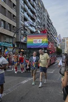 Open top bus with rainbow decorations during Pride celebration in Valencia Stock Photos