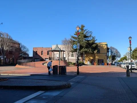 Open town square with circular pathway leading to a central gazebo Fotos de archivo