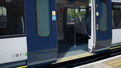 Open train doors showing the platform and modern interior. Stock-Footage 319724439