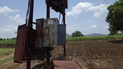 An open transformer box highlights an energy crisis amid resource scarcity. A fa Vídeo Stock 336561529