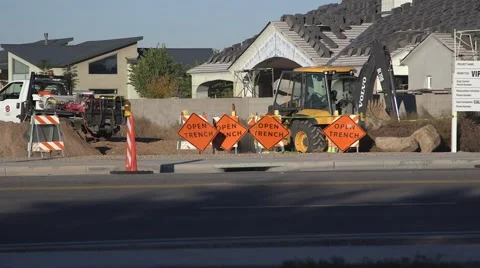Open trench signs in front of workers digging trench Stock Footage 45482803