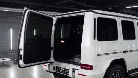 The open trunk of a white car. Rear-eye of a presentable SUV Video stock 133714260