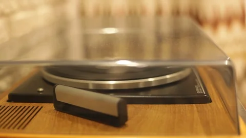 Open the turntable, put the vinyl plate on, turn on Stock Footage 90627795