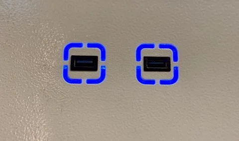 An open USB port for connecting the device in public transport for passengers Stock Photos