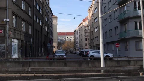 Open view of buildings with car traffic on the street. Stock Footage 152727357