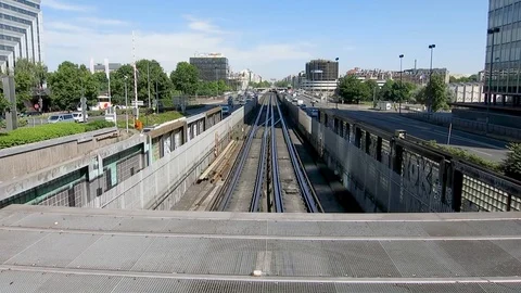Open view over a train rail and road transit with the city of Paris on the Stock Footage 116911598