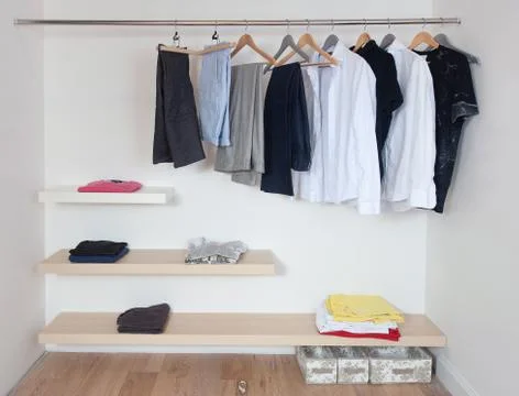 Open wardrobe with clothes Stock Photos