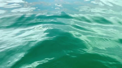 Open water surface of the sea with small waves. Natural background with sun spar Stock Footage 339358001