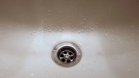 Open water tap in a bathroom Stock Footage 123899638