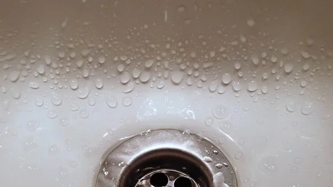 Open water tap in a bathroom Stock Footage 123899663