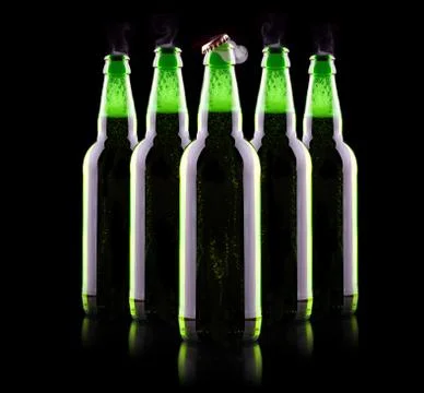 Open wet beer bottle Stock Photos