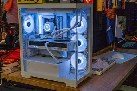 Open white computer case with blue LED lighting, internal components visibl.. Stock Photos
