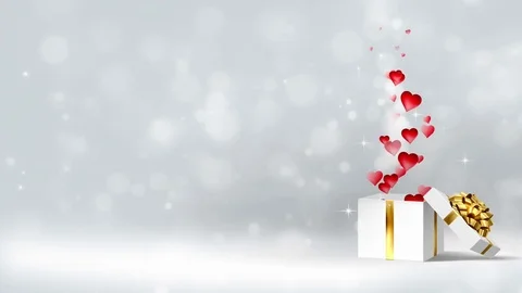 Open white holiday gift box with gold bow and with flow red and pink hearts Stock Footage 85155620