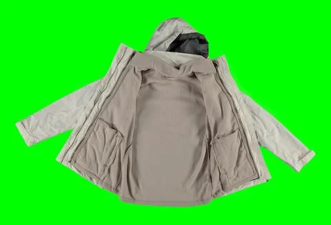 Open white warm jacket. Isolated white women's jacket on a green background. Stock Photos
