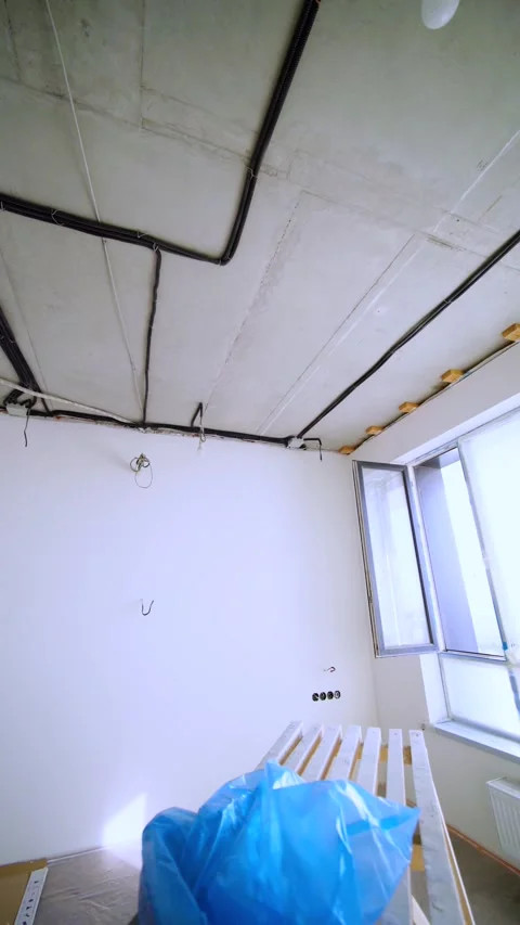 Open Window and Exposed Ceiling Conduits During Interior Remodeling Stock Footage 342990555