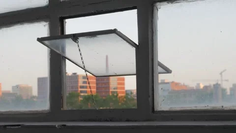 Open window at appartment. View of sun set close-up. City urban concept Stock Footage 261058507