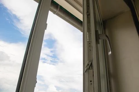 Open window on the blue sky background Stock Photos