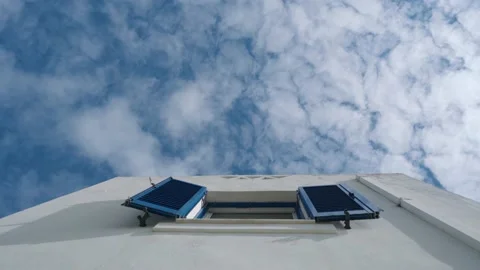 Open window on Greek island, clouds passing over blue sky Stock-Footage 196583697