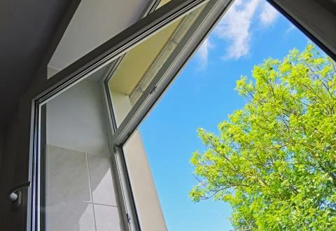 Open window overlooking the sky and the tree Stock Photos