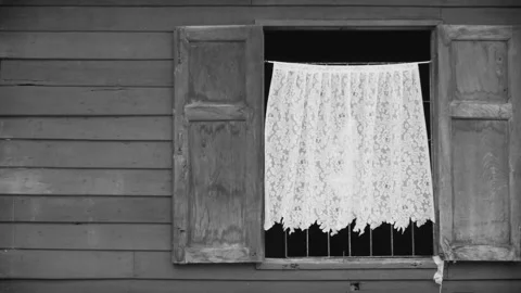 Open window with white curtain moving by the wind.black and white color Stock Footage 133513016
