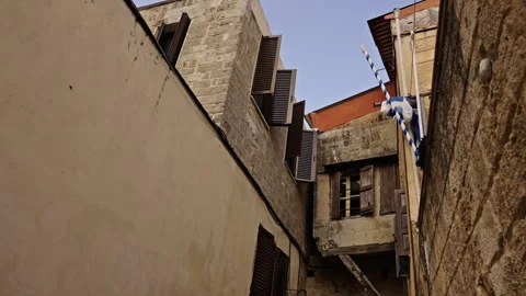 Open windows in an old town made of stone Stock Footage 267325173