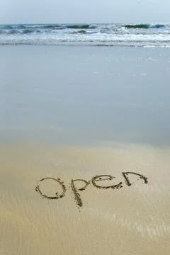 Open written in sand Stock Photos
