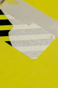 An open yellow package with a torn protective sticker against opening , a tor Stock Photos