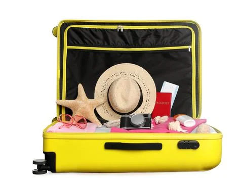 Open yellow suitcase with different beach objects on white background 스톡 사진
