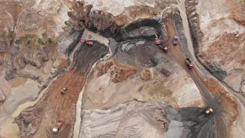 Opencast mining clay or calx quarry with lots of machinery trucks, aerial top Stock Footage 141287975