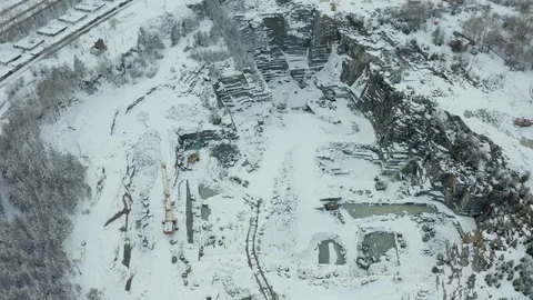 Opencast mining of granite beautiful snowy winter, top view grom drone. Stock Footage 126673033