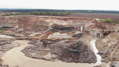 Opencast mining quarry with lots of machinery. Iron ore quarry from bird's eye Stock Footage 141283686