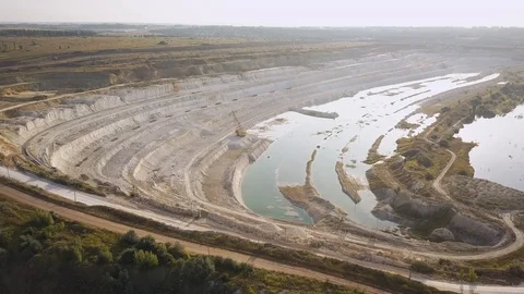 Opencast mining quarry with machinery at work - Aerial view. Industrial Extra Stock-Footage 113797658