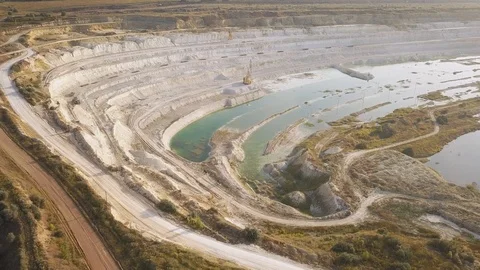 Opencast mining quarry with machinery at work - Aerial view. Industrial Extra Stockbeeldmateriaal 113797744