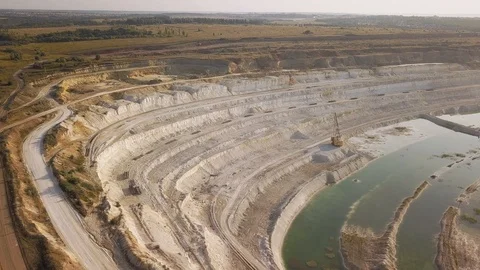 Opencast mining quarry with machinery at work - Aerial view. Industrial Extra Stock-Footage 113798687