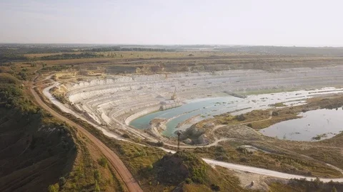Opencast mining quarry with machinery at work - Aerial view. Industrial Extra Stock-Footage 113799314